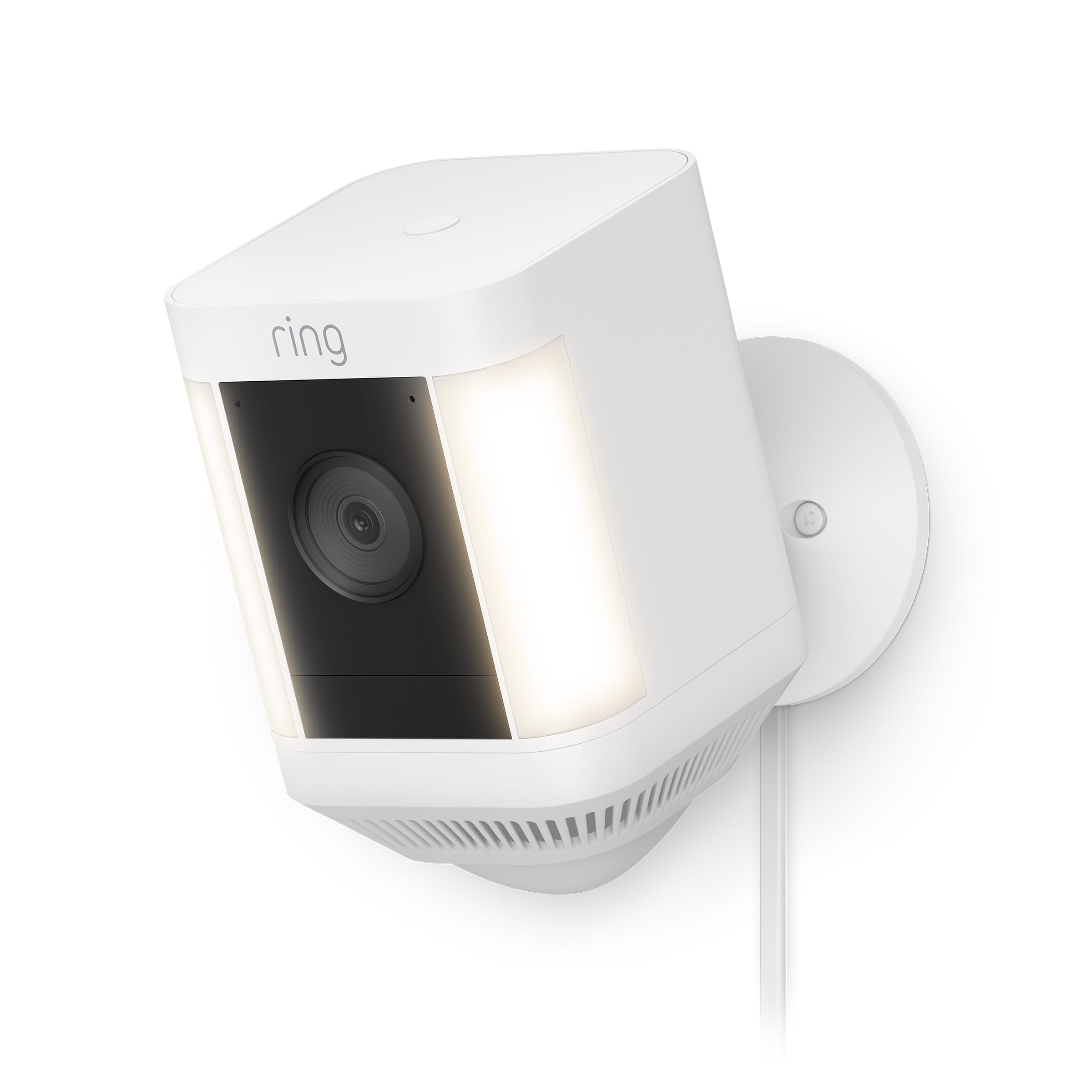 Ring Spotlight Cam Plus mounted on an exterior wall with spotlights activated